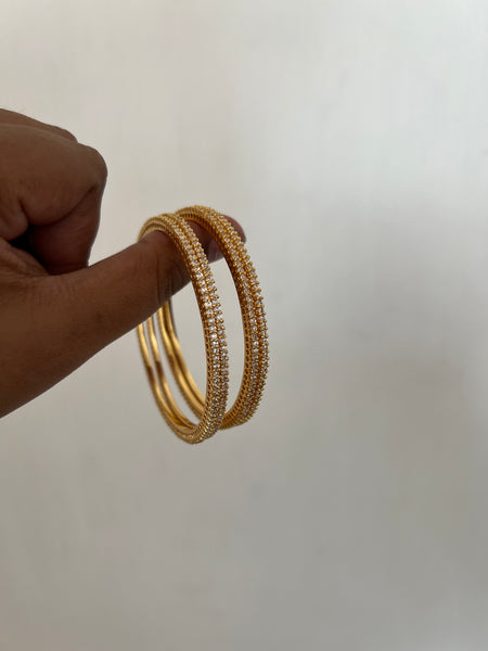 Tiny stone gold look alike bangles set of 4