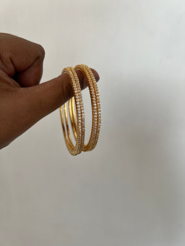 Tiny stone gold look alike bangles set of 4