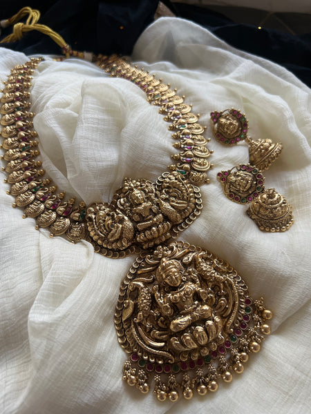 Nagas Lakshmi coin haram with oversized pendant and jhumkas