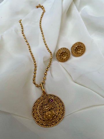 Golden peacock with kemp stone and studs in a maala