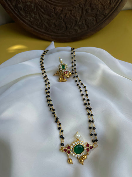 Emerald stone black bead mangalsutra with studs